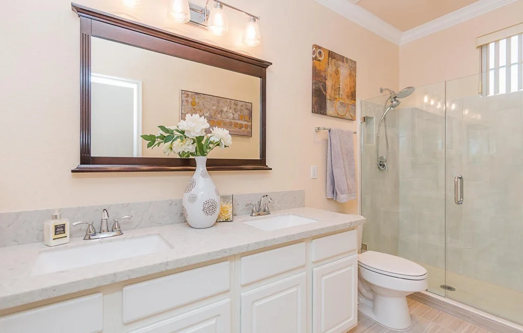Second view of the completed kitchen and bath remodel showing the finished cabinetry and stone